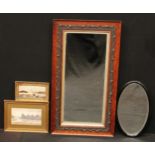 An oak framed rectangular wall mirror, moulded leafy scroll border, 86cm x 48cm overall; an oval