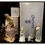 A Lladro figure, Poetic Moment, boxed; others, Sleepy Kitten, boxed; Cat and Mouse, boxed; girl with