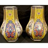 A pair of Chinese export ware printed polychrome hexagonal baluster vases, decorated with