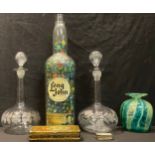 A novelty marble filled Long John whisky bottle, once a table lamp, 43cm; a Mdina glass vase; a pair