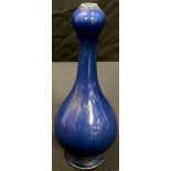 A Chinese blue glazed onion top bottle vase, 17cm high