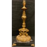An ornate French gilt cherub lamp, on marble base, paw feet, 48cm