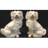 A pair of 19th century Staffordshire flat back King Charles Spaniel mantel dogs, 22cm