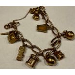 A 9ct gold charm bracelet, including ten charms, 31g