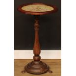 A rosewood occasional table, circular top with embroidered panel, turned column, stepped circular