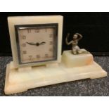 An Art Deco onyx rectangular clock, the square dial with Arabic numerals, the rectangular base