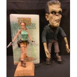 A resin model of Tomb Raider's Lara Croft, 38cm, boxed; a novelty Frankenstein's Monster bendy