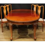 A Queen Anne style extending dining table, two additional leaves, cabriole legs, ball and claw feet,