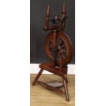 A 19th century elm spinning wheel