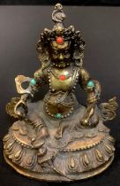 A gilt bronze model of a Deity, inset with coral and turquoise, 12cm high