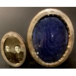 A George V silver easel photograph frame, Birmingham 1916; another, circular, London 1929 (2)