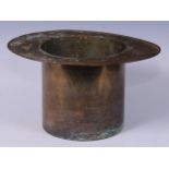 A novelty brass Champagne bucket or wine cooler, as a top hat, 18cm high, 33.5cm wide, 27.5cm