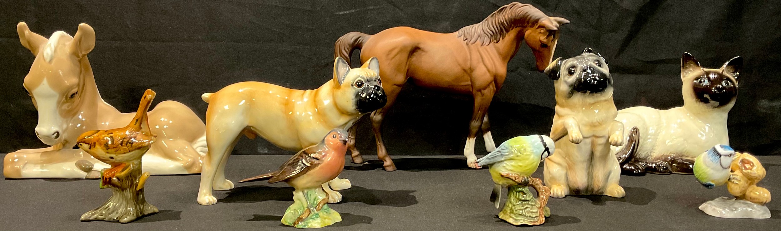 A Beswick model of a French Bulldog; another, Pug; a Beswick Siamese cat; Beswick bird models; a