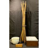 A set of late 19th century bamboo brass mounted extending drain rods; a set of dominoes, cased; a