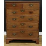 A mahogany chest, of two short over four long graduated drawers, pine sides, skirted base, bracket