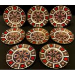 A set of seven Royal Crown Derby Imari palette 1128 pattern tea plates, 16cm diameter, first