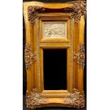 Interior Decoration - a gilt framed looking glass, inset with plaque moulded in relief with putto