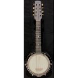 Musical Instruments- a banjo ukulele or banjolele, 60cm long; another (2)