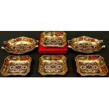 An associated pair of Royal Crown Derby Imari palette 1128 pattern shaped oval pin dishes, one a