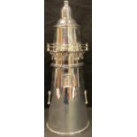 An Art Deco style silver plated cocktail shaker as a lighthouse, 34cm high