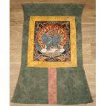 A Tibetan thangka, painted in gouache with Vajrabhairava, laid on a silk scroll, 82cm x 47cm overall