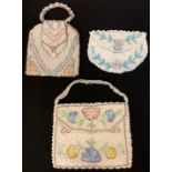 A collection of three beadwork bags