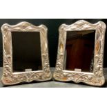 A pair of contemporary Art Nouveau style silver photograph frames, wooden easel backs, London