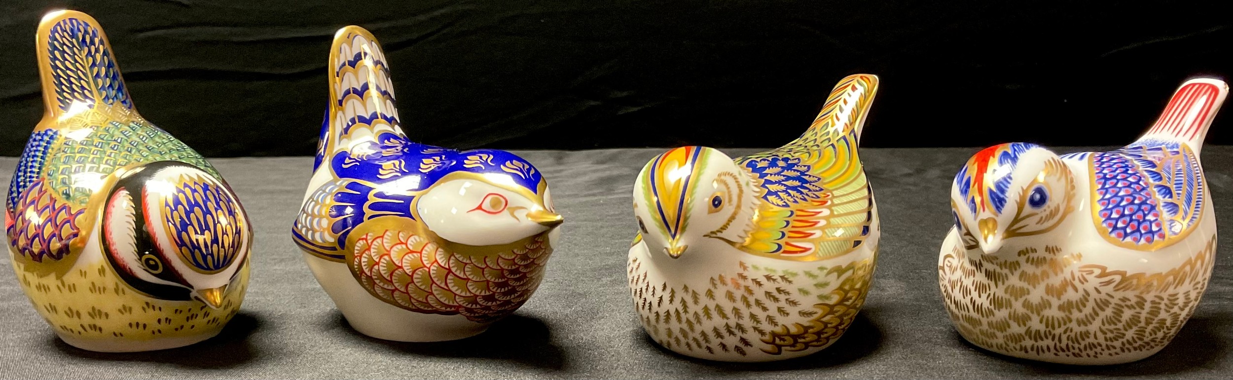 A Royal Crown Derby paperweight, Firecrest, gold stopper; others, Gold Crest, Wren and Blue Tit, all