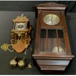 A Dutch Franz Hermle 'Atlas' wall clock; another, oak wall clock, c.1930 (2)