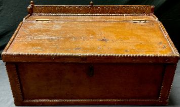 A 19th century Arts and Crafts scumbled pine table top writing box, the gallery carved with