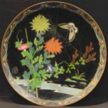 A Japanese cloisonné charger, enamelled with butterfly, spider's web and flowers over a stream, 30.