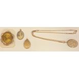 A Victorian locket on chain; other lockets; an oval photograph brooch (4)
