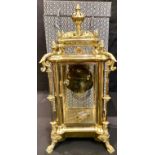 A large French style gilt metal mantel clock, the 12cm enamel dial with twin winding holes, "