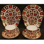 A pair of Royal Crown Derby Imari palette 1128 pattern teacups, saucers, tea plates and side plates,