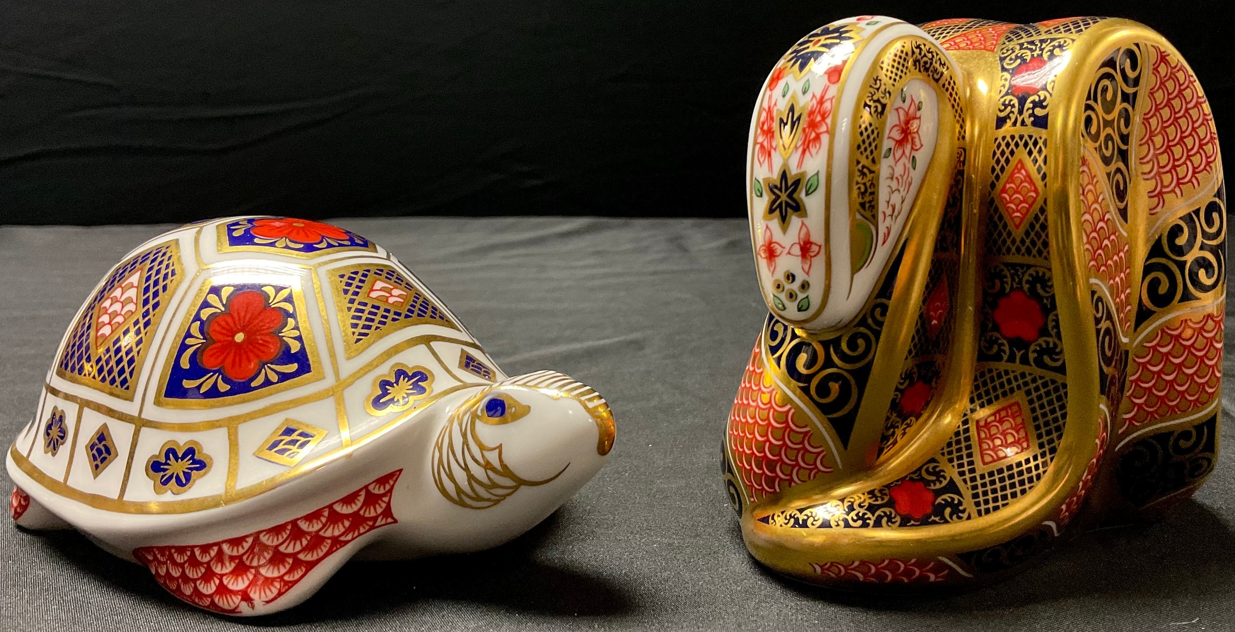 A Royal Crown Derby paperweight, Imari Snake, gold stopper; another, Imari Tortoise, gold stopper (