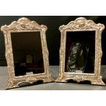 A pair of contemporary Art Nouveau style silver photograph frames, wooden easel backs, London