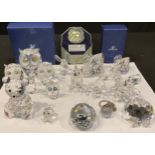 A Swarovski Crystal model bear, three graduated owls, kangaroo, four graduated swans, giraffe,