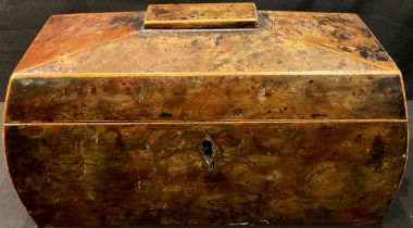 A George III yew tea caddy, hinged cover enclosing a pair of canisters and a bowl, 32cm wide, c.1810