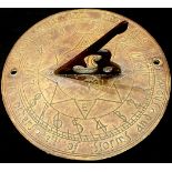 A bronze sundial, 20cm diam