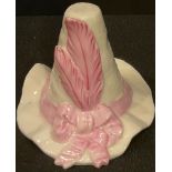 A Worcester Royal China Works candle snuffer, Tyrolean Hat, with pink feather and ribbon, 6.5cm