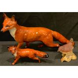 A large Beswick model of a fox; another, smaller; a Beswick wren (3)