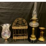 A Victorian oil lamp, clear glass font, brass columnar support, part converted to electricity,