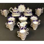 A mid 19th century Staffordshire part tea service comprising cake plates, sucrier, slop bowl,