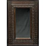An early 20th century oak rectangular mirror, carved with stiff leaves, 92cm x 60cm