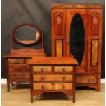 A walnut three piece bedroom suite, comprising wardrobe, 192cm high, 109.5cm wide, 43cm deep,