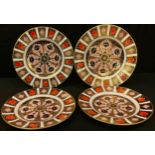 A pair of Royal Crown Derby Imari 1128 pattern plates, 23cm; a similar pair of smaller 1128