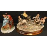 An Italian Naples figure group by J Monelli, Piggy Back, stepped oval wooden plinth base, 45cm wide;