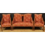 An Edwardian mahogany three-piece drawing room suite, comprising sofa and a pair of chairs, the sofa