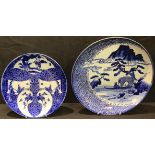 An early 20th century Japanese blue and white charger, 29cm diameter; another similar, 35.5cm