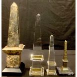 A marble library desk obelisk, wooden plinth base, 36cm high; a glass desk obelisk, 31cm high;